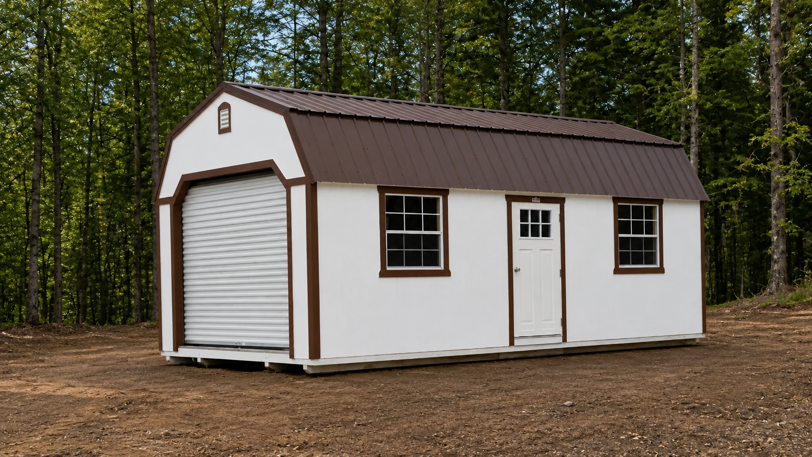 White lofted barn garage with brown trim, brown metal gambrel roof, front roll-up garage door, white walk-in side door, and two grid windows in Knoxville, Tennessee.