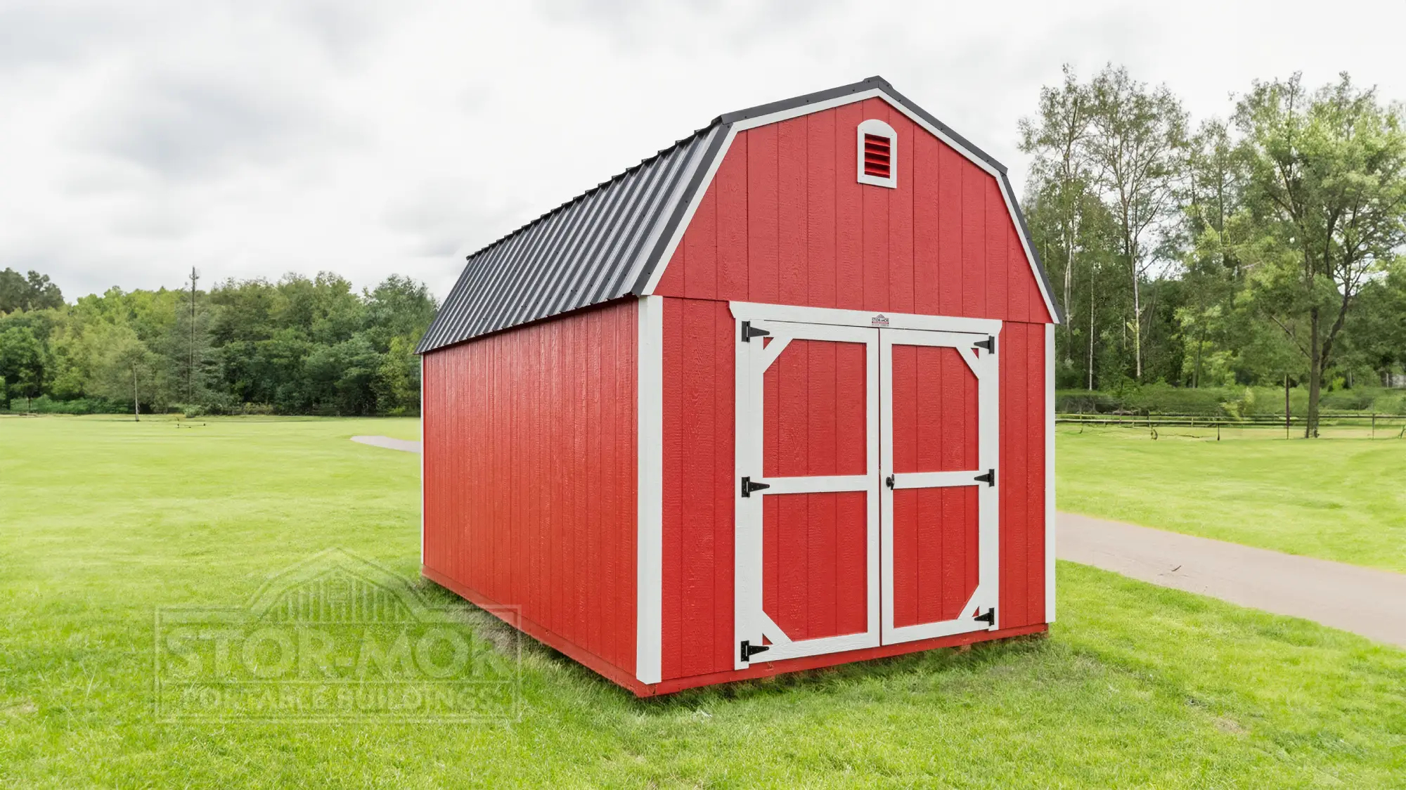 Natural stained wooden cabin shed featuring a side front porch with railings, black roof, white walk-in door, double windows, and loft windows set on gravel in Asheville, North Carolina.