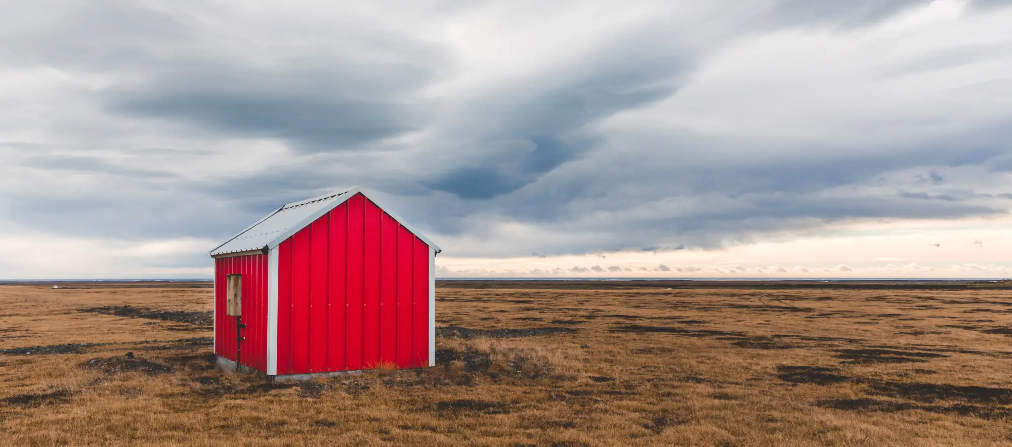 small-lone-barn-in-iceland-with-dramatic-clouds-in-2026-03-17-05-53-30-utc