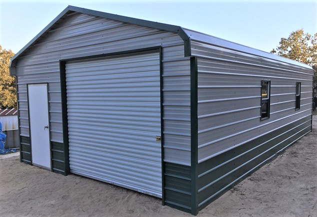 Metal building with open garage doors