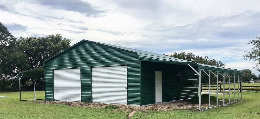 Metal garage surrounded by trees.