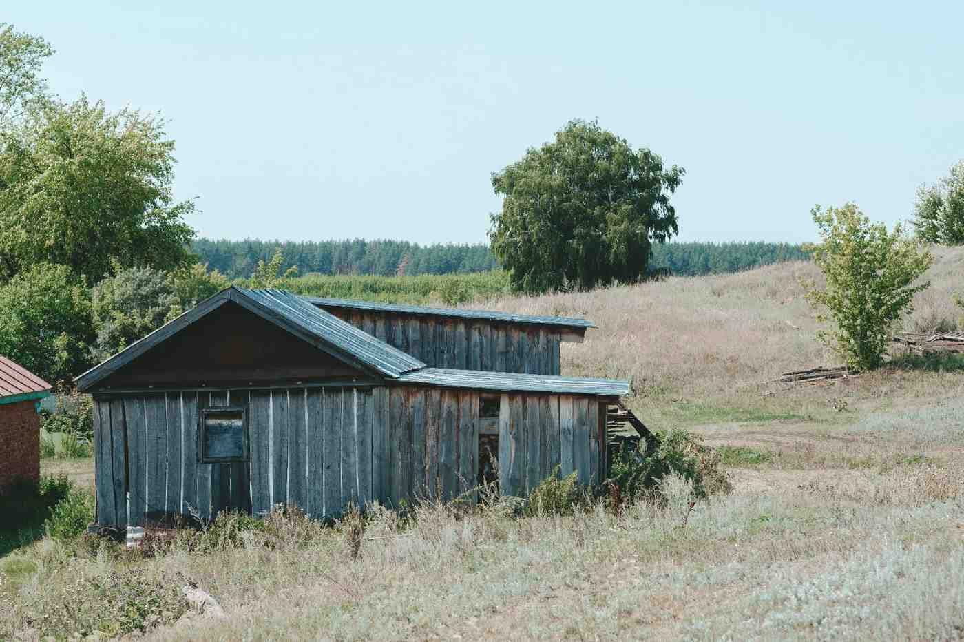 an-old-wooden-mountain-hut-on-a-green-meadow-with-2026-03-19-10-41-16-utc