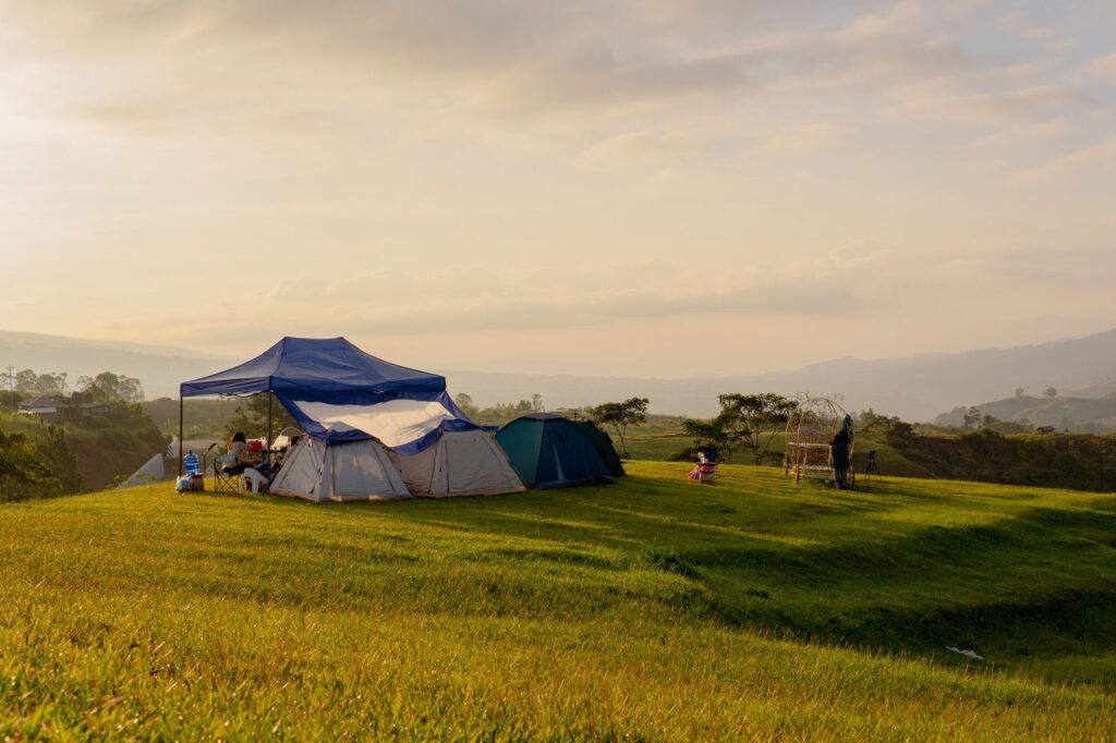 family relaxing under a custom pavilion instead of outdoor tent structures