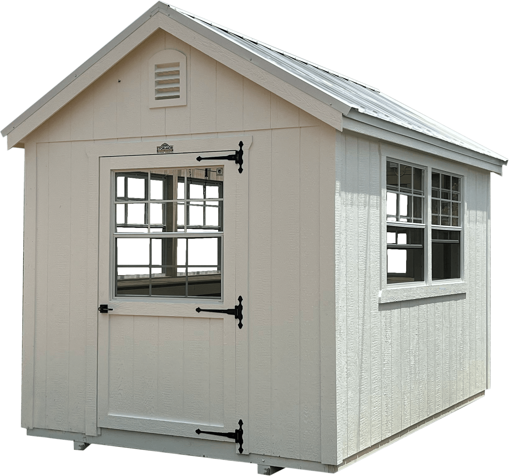 Isolated view of a custom white wooden greenhouse shed featuring black door hinges, double grid windows, a gable roof vent, and a metal roof in Summerfield, FL.
