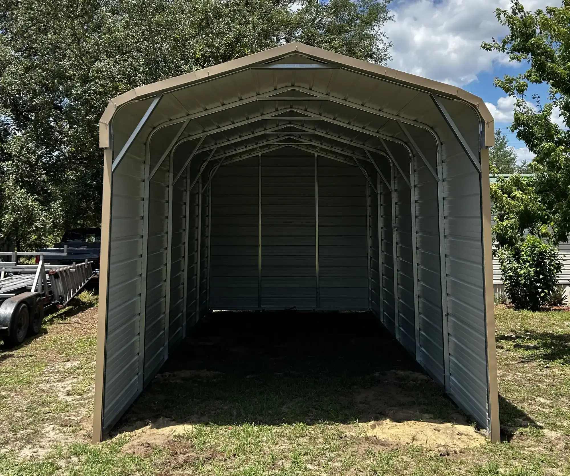 Empty metal carport structure outdoors