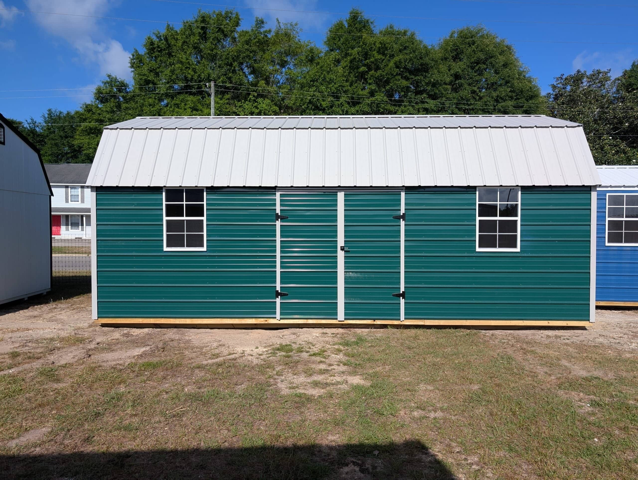 Green barn shed with metal roof