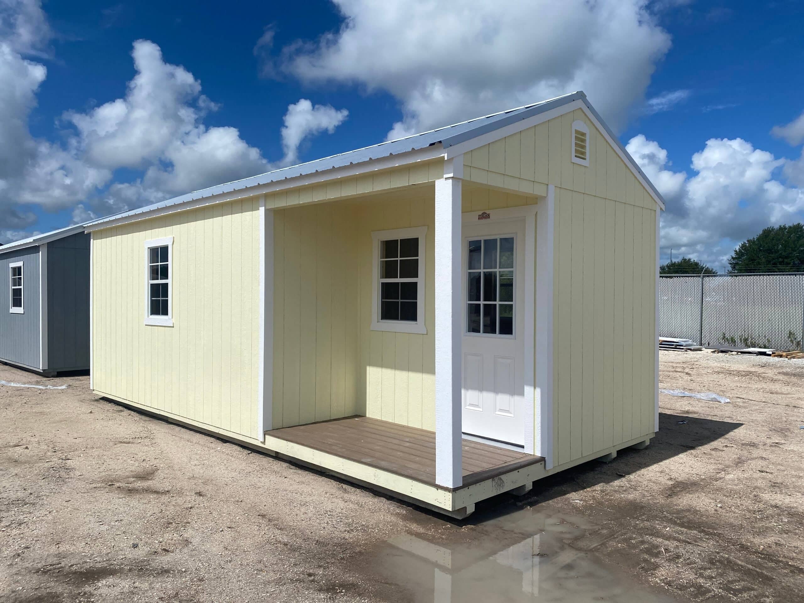 Yellow cabin with porch and windows